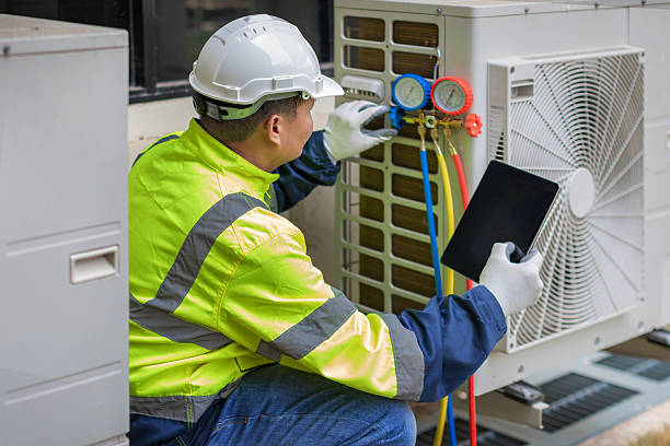 Professional Heat Pump Repair technician working in Orange Beach, AL